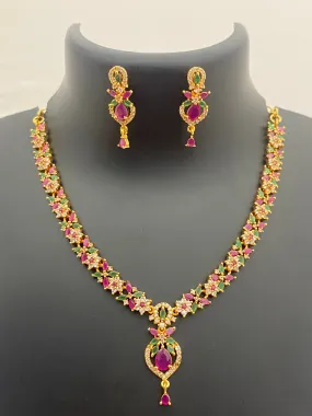 Pretty Gold Plated Multi Color Stoned With Floral Designer Necklace And Earrings